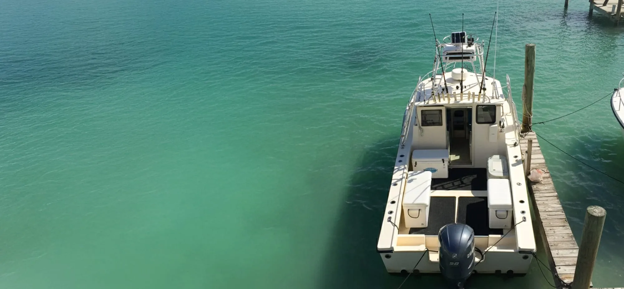 Aerial view of Satisfaction on clear green water